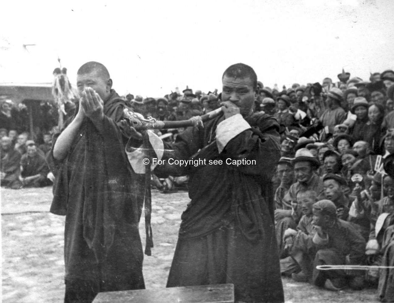 Two monks with ganlin during the Tsam performance. 